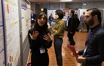 Participants discussing poster.